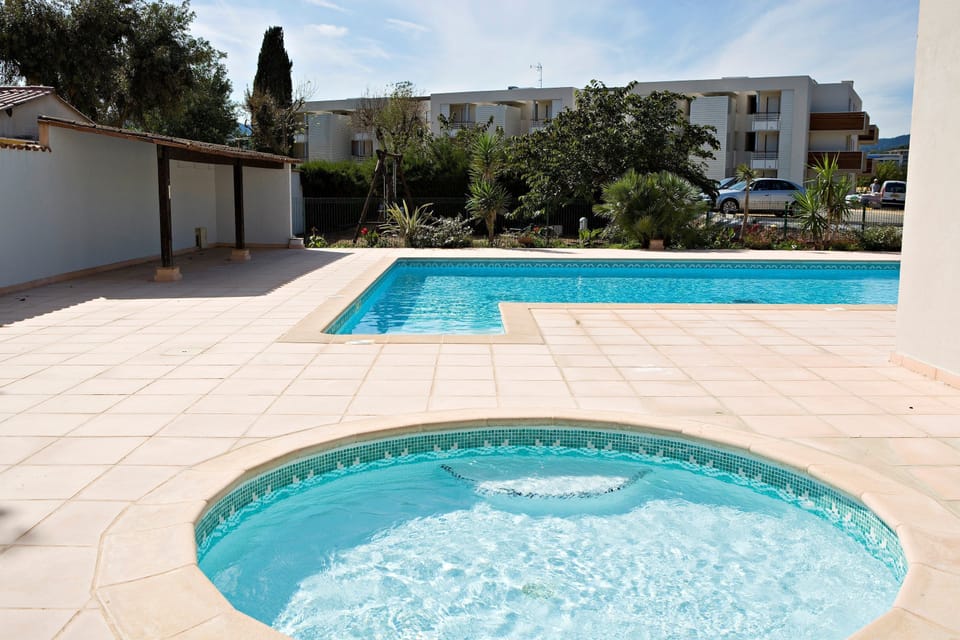 Lounge by the pool in the sunshine.