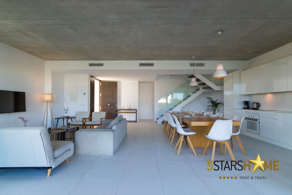 Open living room with garden and pool view