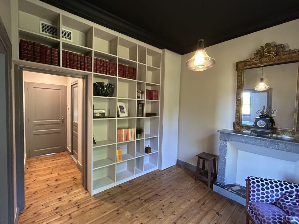 Library and a armchair adjacent to the bedroom #4