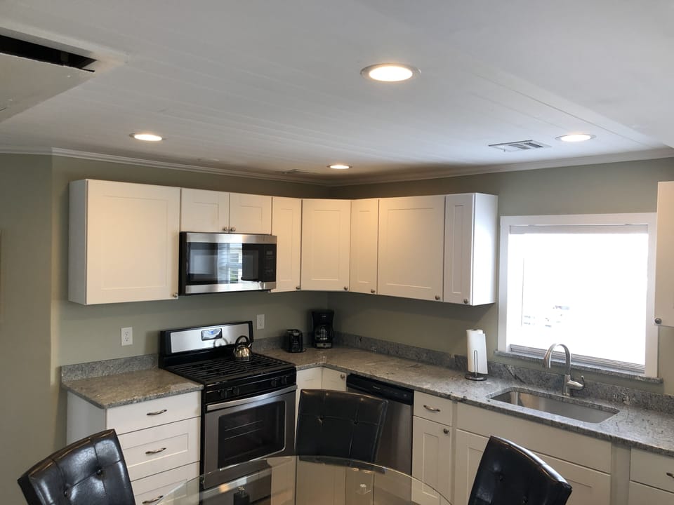 Newly renovated kitchen with white cabinets