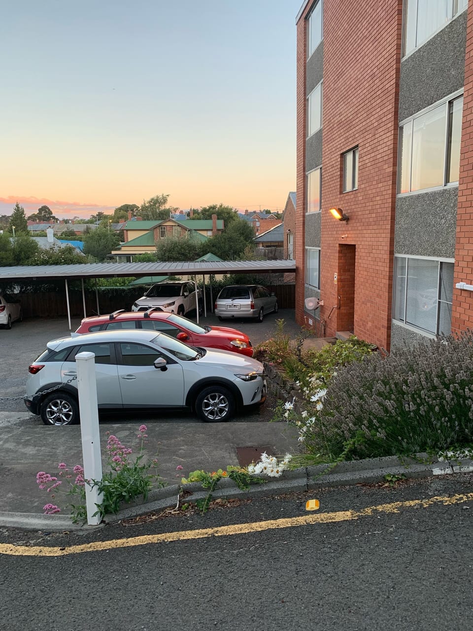 Car parking area at back of building, right next to the back door. 