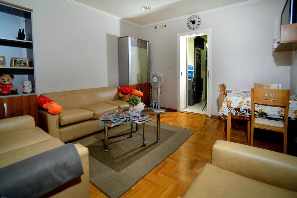 living room with balcony seating area and dining teable