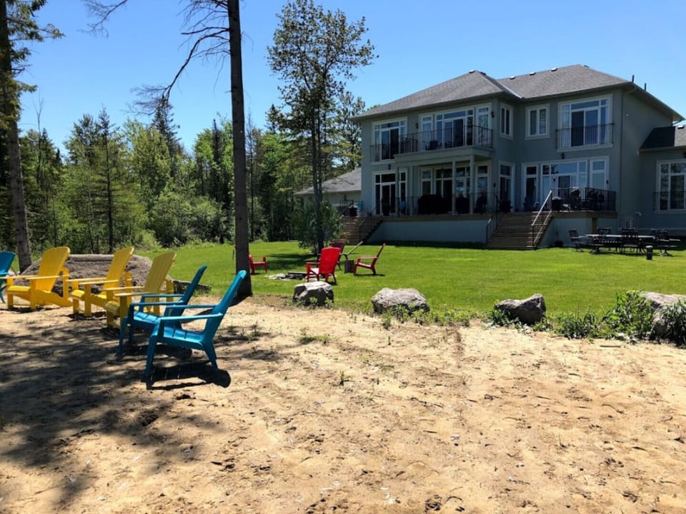 Lakehouse from water - plenty of room for outdoor relaxing and games.