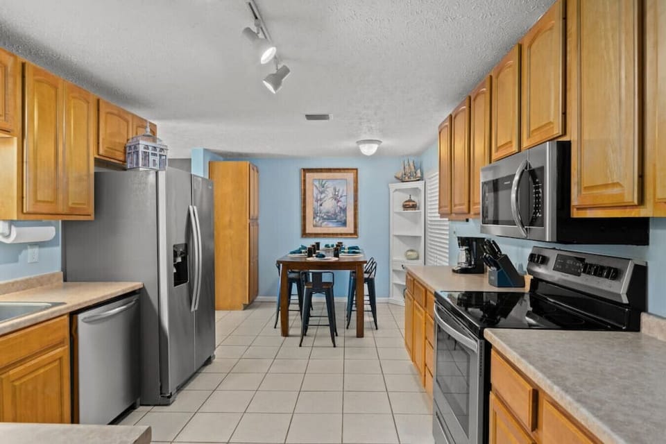 Large kitchen with stainless steel appliances. Fully-stocked and ready for you to whip up a meal for your group!