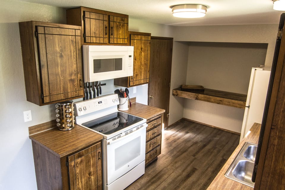 New range/oven and microwave/hood vent, spices, knives, utensils, etc.