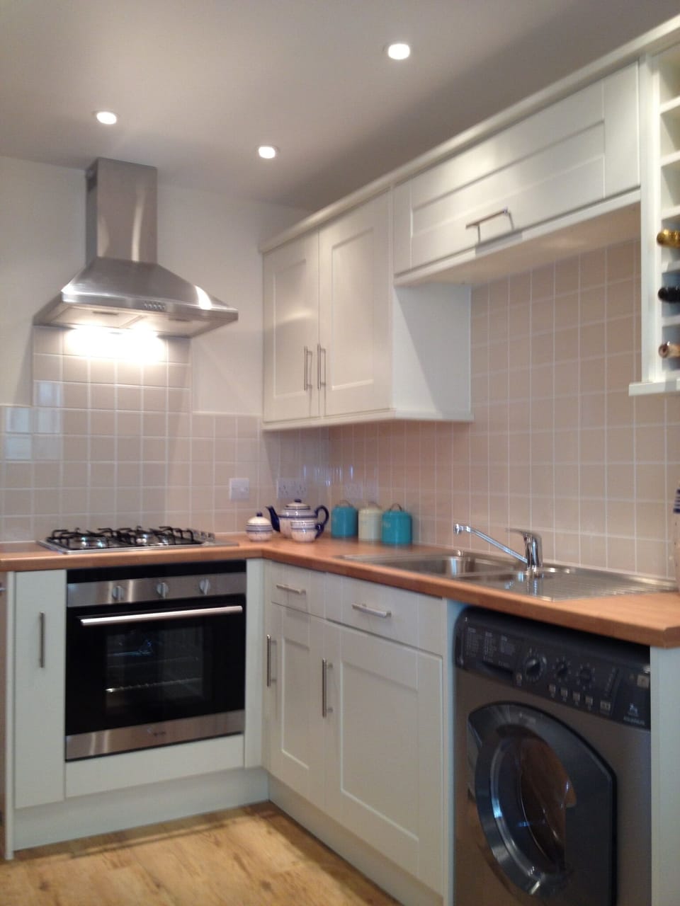 Modern kitchen with gas hob, electric oven/grill, microwave and washer/dryer