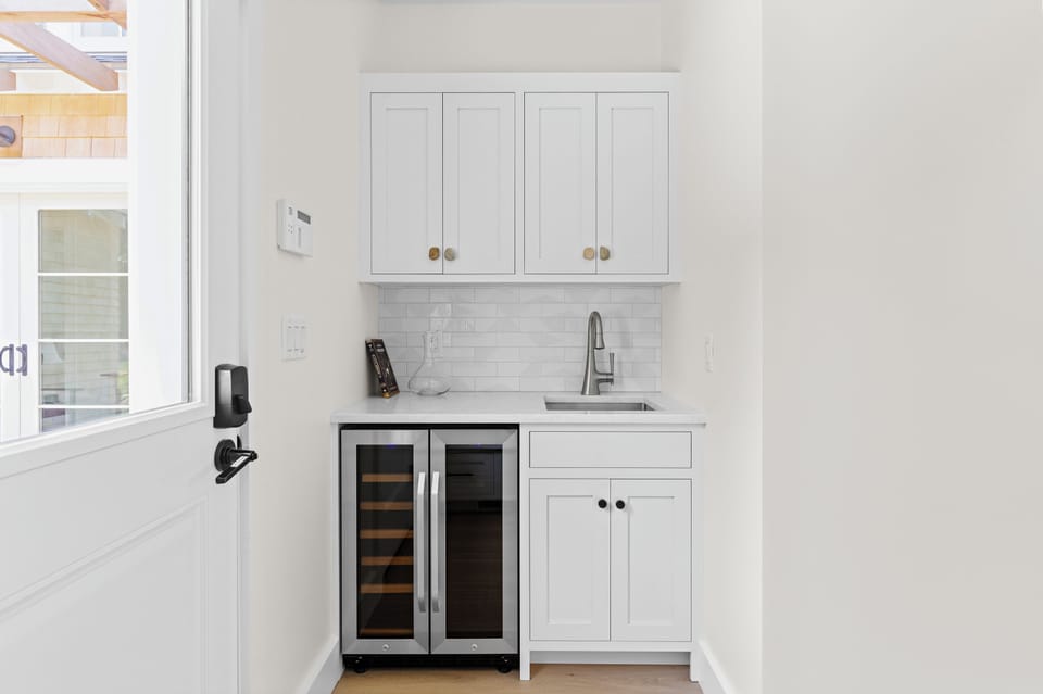 Wet bar area with beverage fridge