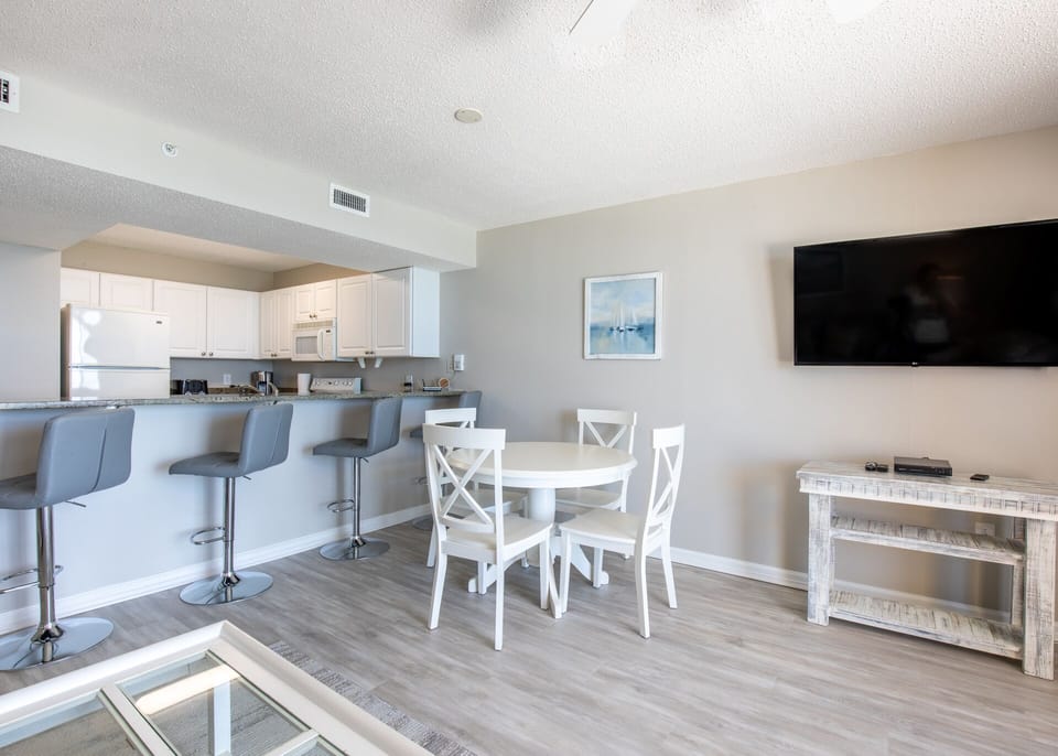 Dining/Bar area - Large flat screen TV can be seen from living/bar/dining area