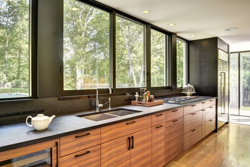 Galley kitchen. View of pool