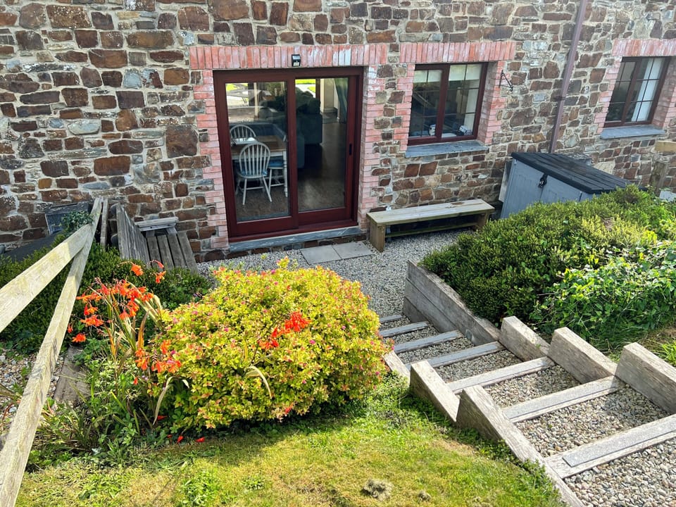 Rear of the cottage, a real sun trap and rural views.