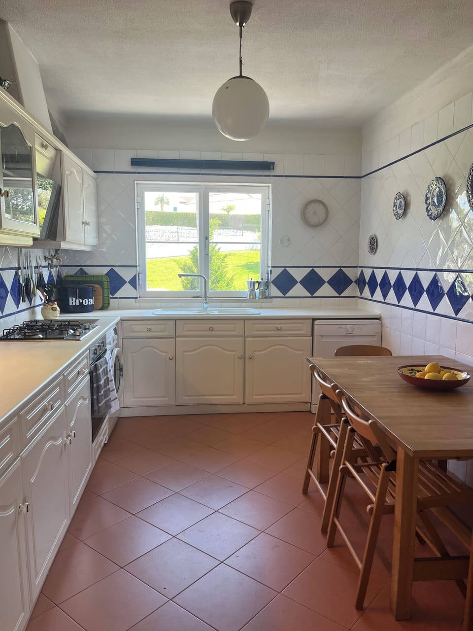 Kitchen with garden and tennis court view