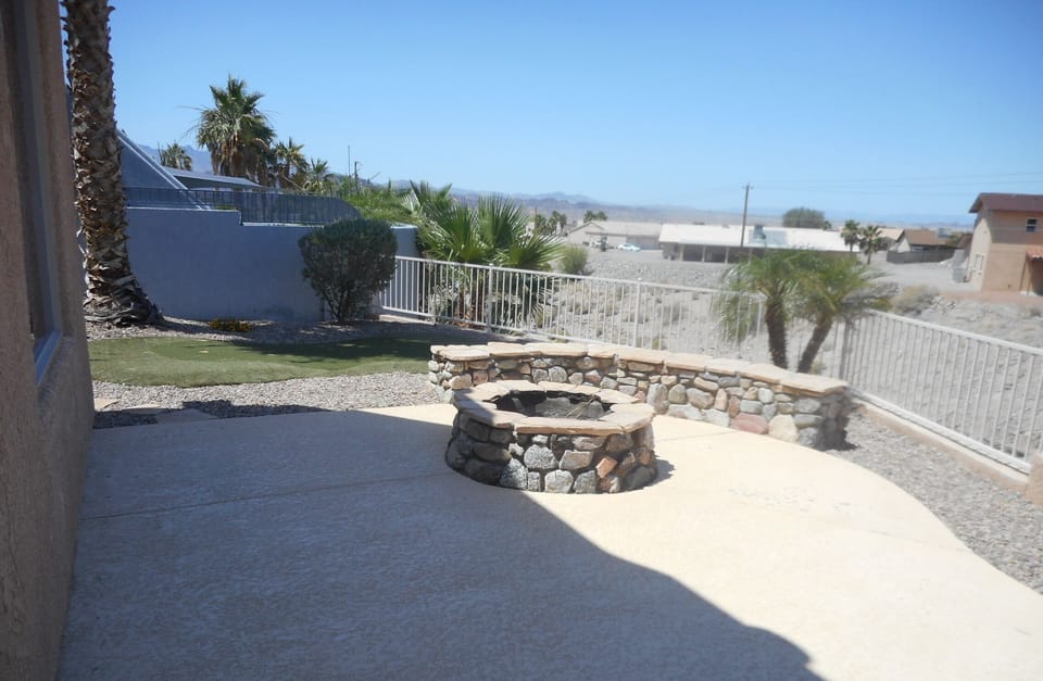 Wood burning fire pit with seating for 5 and a block wall w/seating for more! 