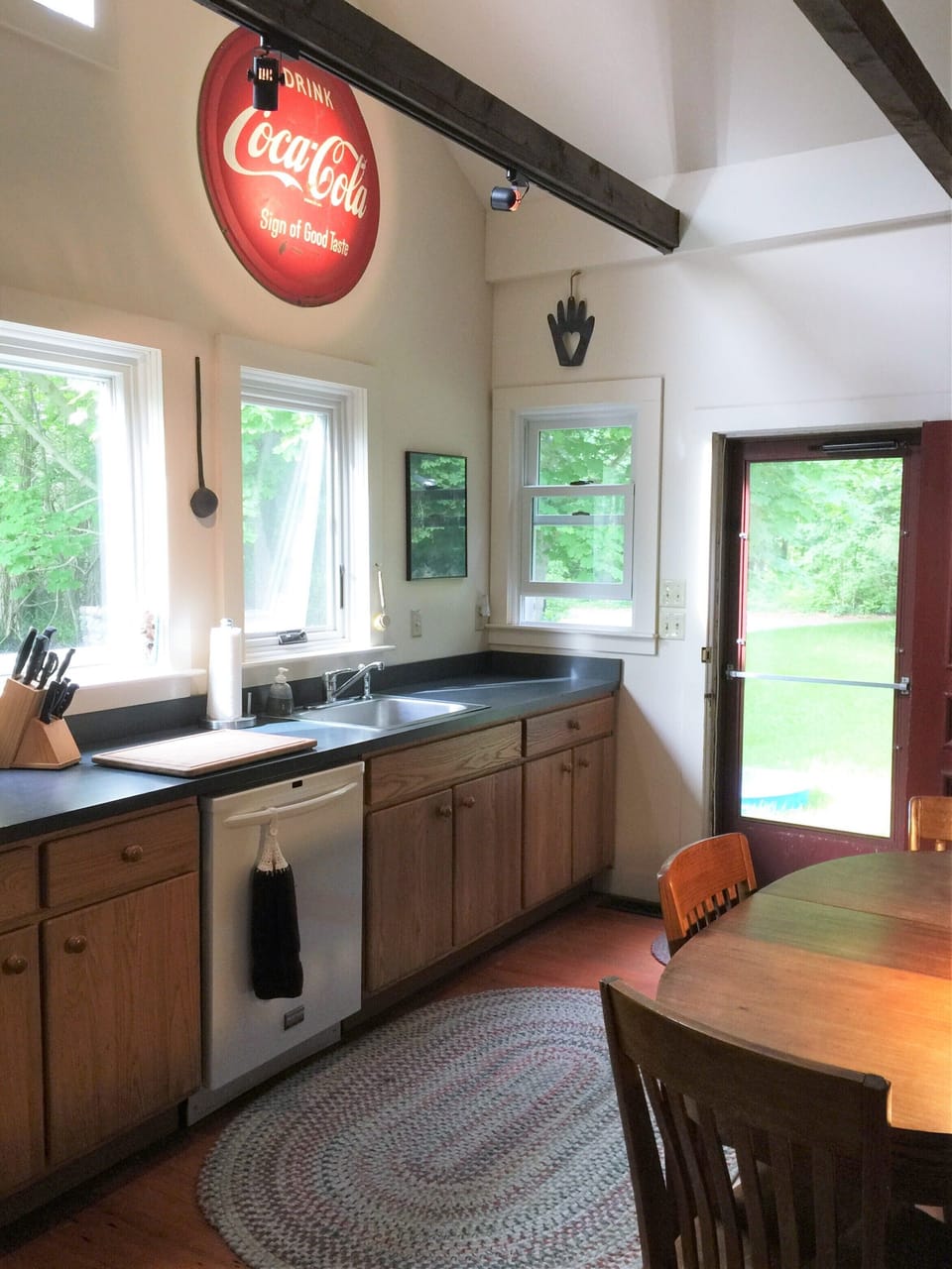 Cheerful, sunlit kitchen with a table for 3-4.