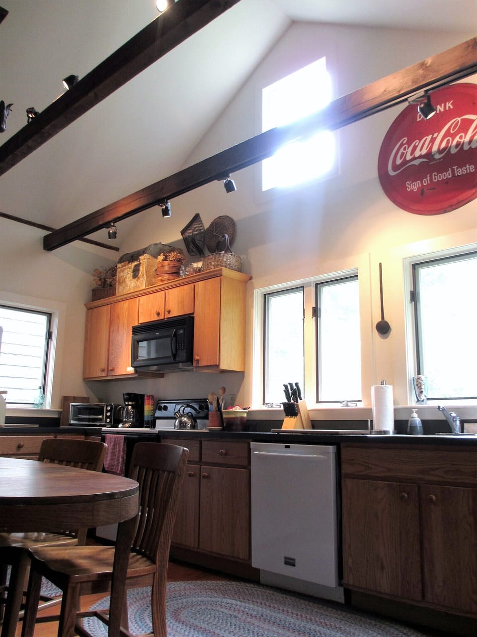 Well-equipped kitchen with cathedral ceiling, and seating for 3-4.