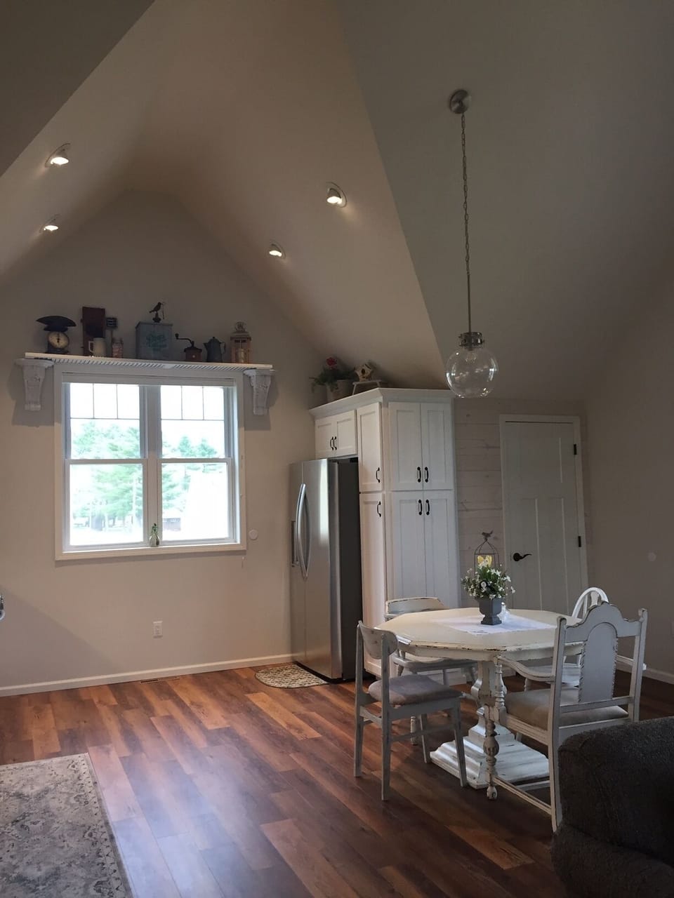 Kitchen with full-size refrigerator and pantry.  

