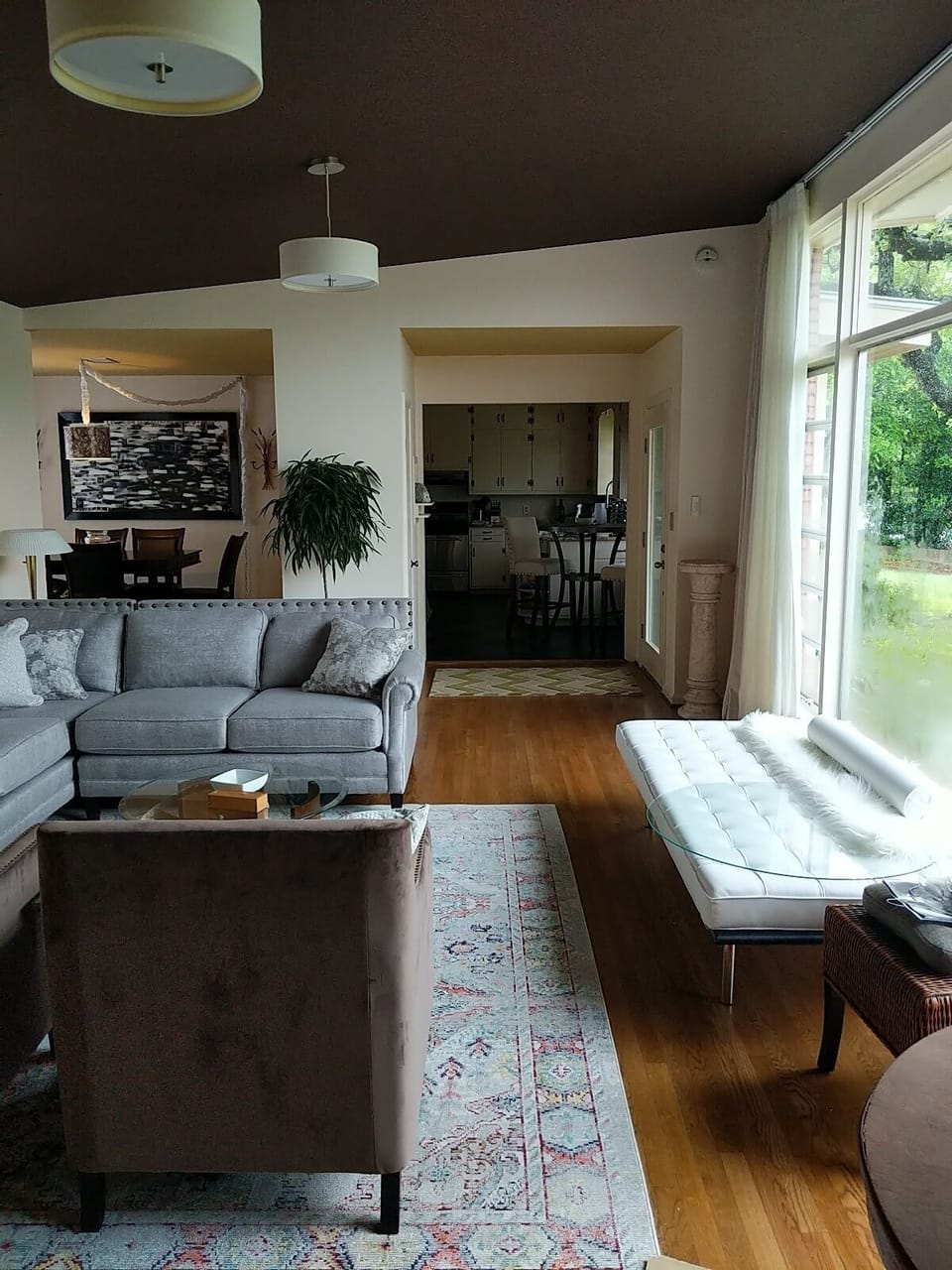 Large living area, open concept, electric drapes covering 20 feet of glass 