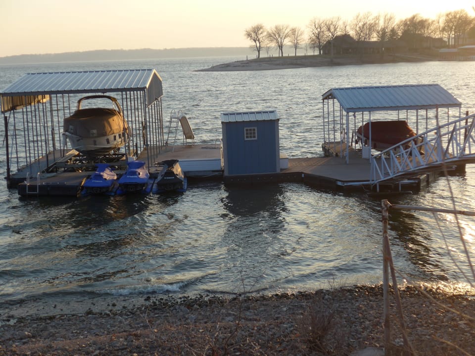 The dock, with slide, diving board, and open slip

