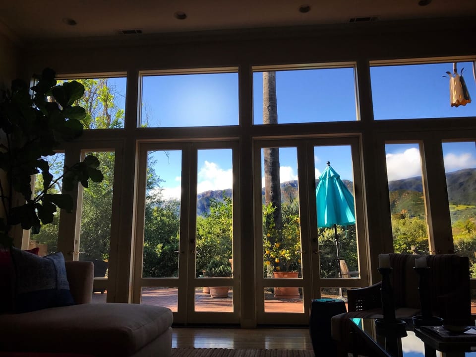 Living room French Doors overlooking patio and Montecito mountains