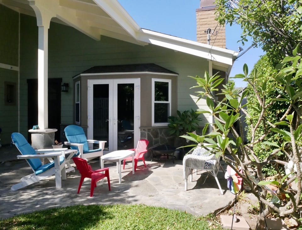 Abundant seating, plumeria, star jasmine, side access to backyard (gated)
