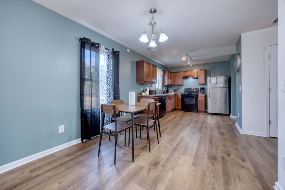 The kitchen with a table and four chairs