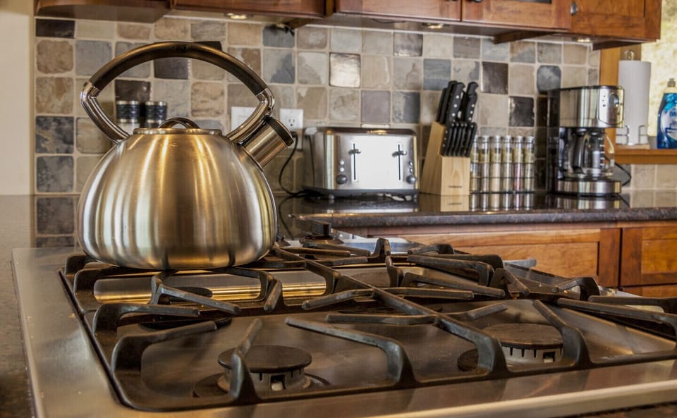 Gas cook top with built-in oven and microwave.