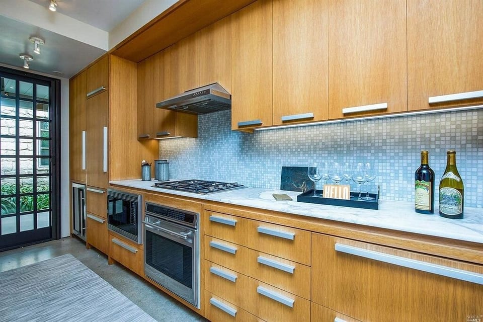 Galley Kitchen includes wine fridge, dishwasher, micro, oven. 