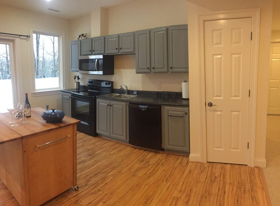 food pantry to the right of kitchen cabinetry