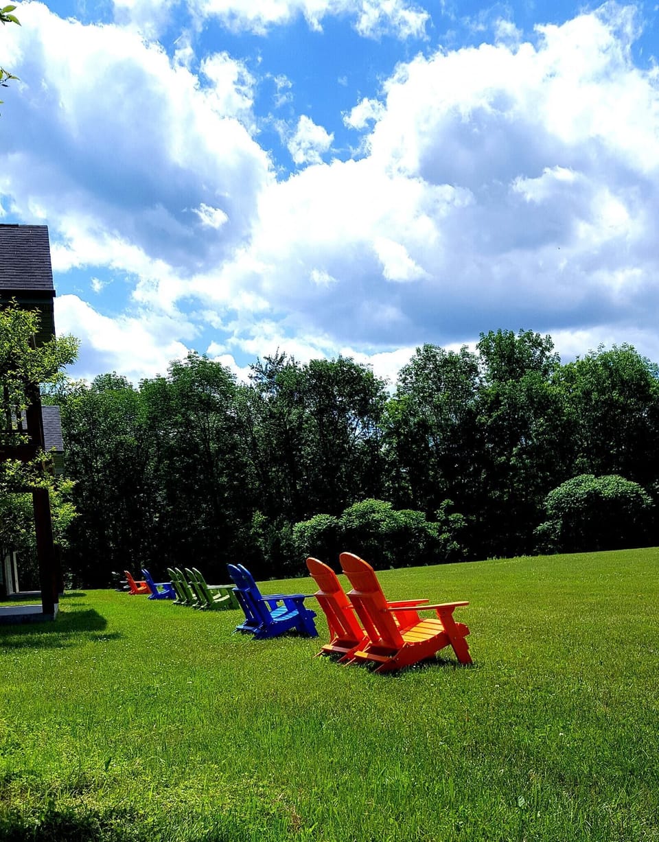 Outdoor seating area in front of condo units