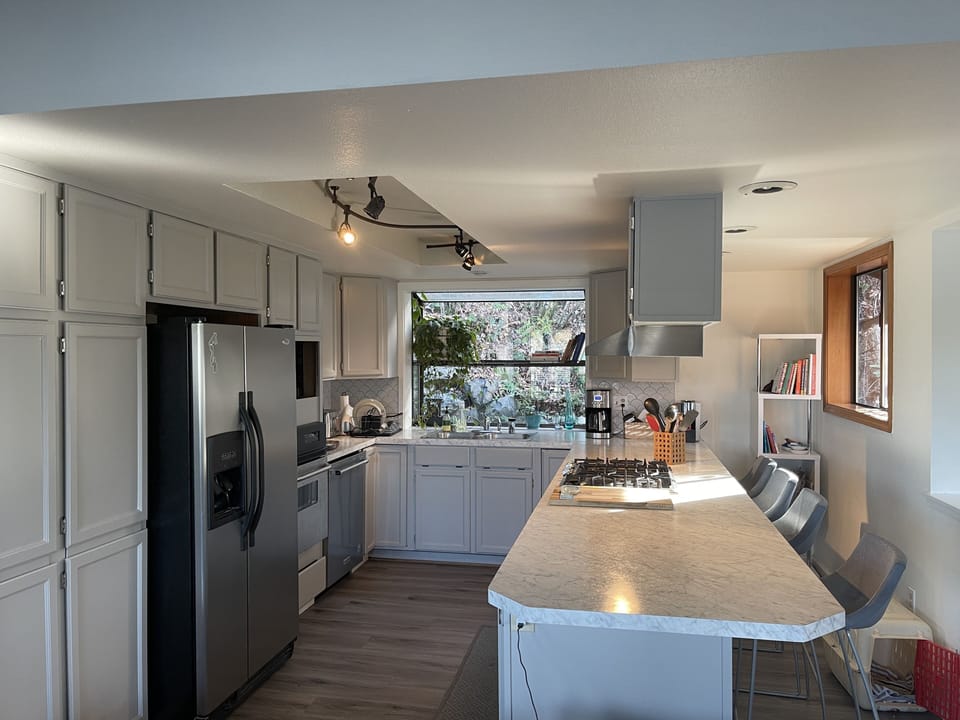Fully stocked kitchen with ample storage space. Open layout 