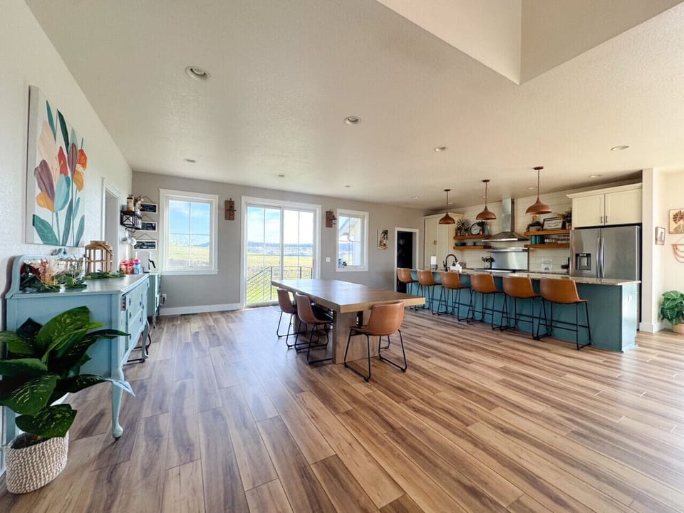 Open and bright floor plan connecting kitchen, living, and dining for the perfect entertainment area. Easy access to rooftop deck and hot tub.
