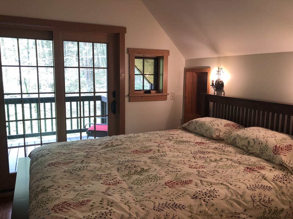 Master bedroom and balcony overlooking Stone Creek