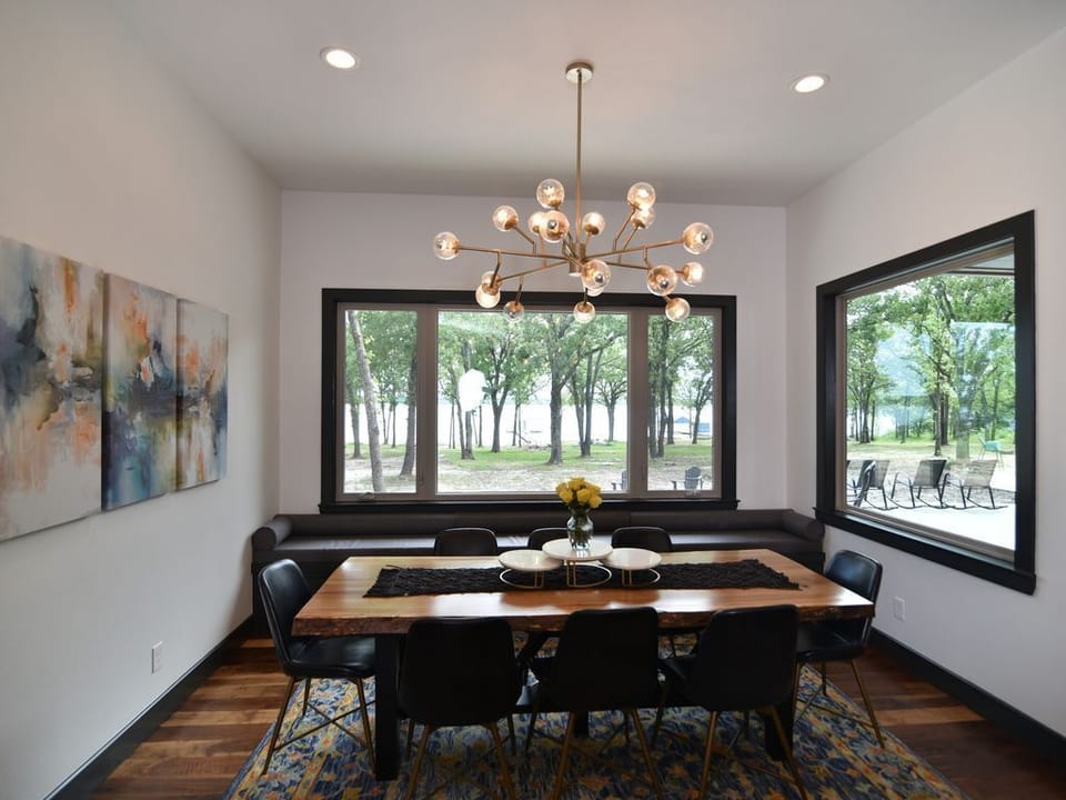 Dining room with large oak table and space for 8 w/ amazing views of lake!