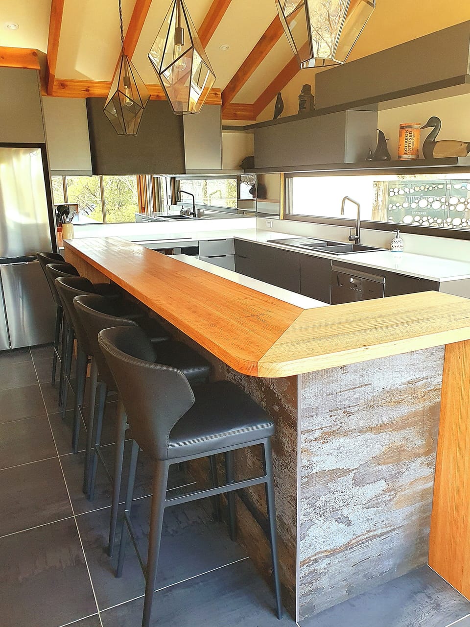 Spacious kitchen features a breakfast bar, ice maker and modern appliances.