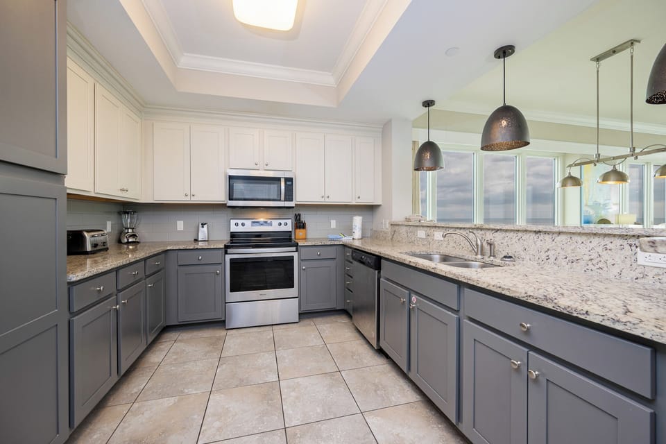 Craft delightful meals in the kitchen with stylish cabinetry and stainless appliances promoting culinary creativity