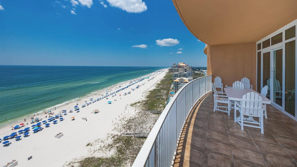 Experience seemingly endless coastline views of the horizon as waves lap the shore and the sun glistens over the water