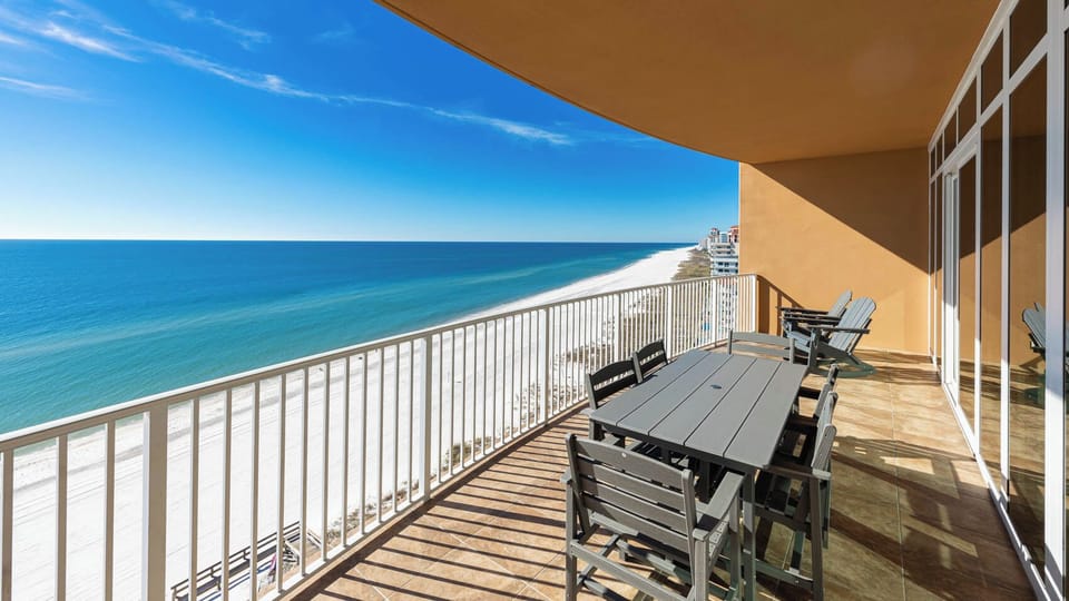 Breathe in the fresh coastal air while relaxing on your balcony with stunning beach views inviting serenity