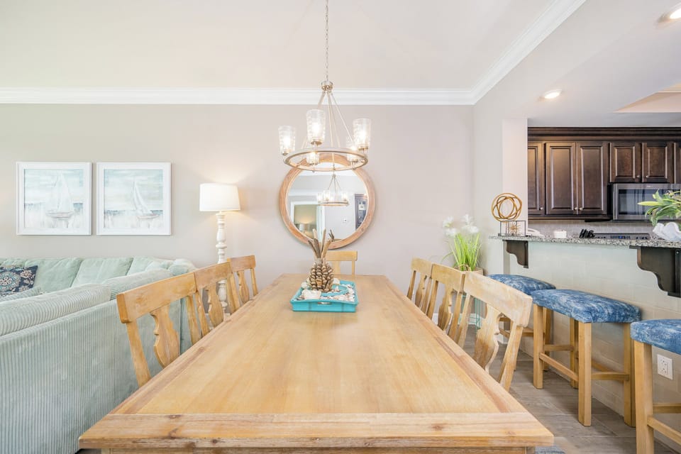 Gather around the inviting dining table, perfect for sharing stories and laughter over your family meals