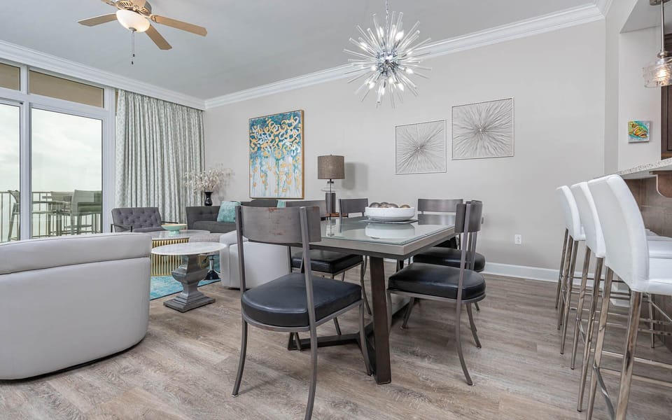 Gather in the chic dining area, savoring moments with loved ones amid stylish decor and soft lighting