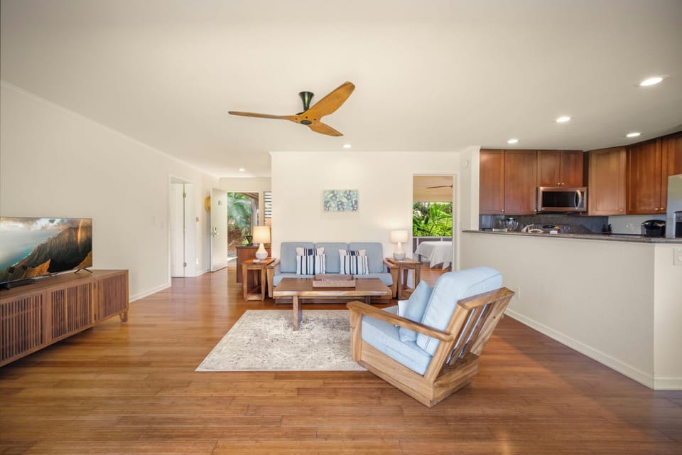 View of the living room, kitchen and bedroom on the right