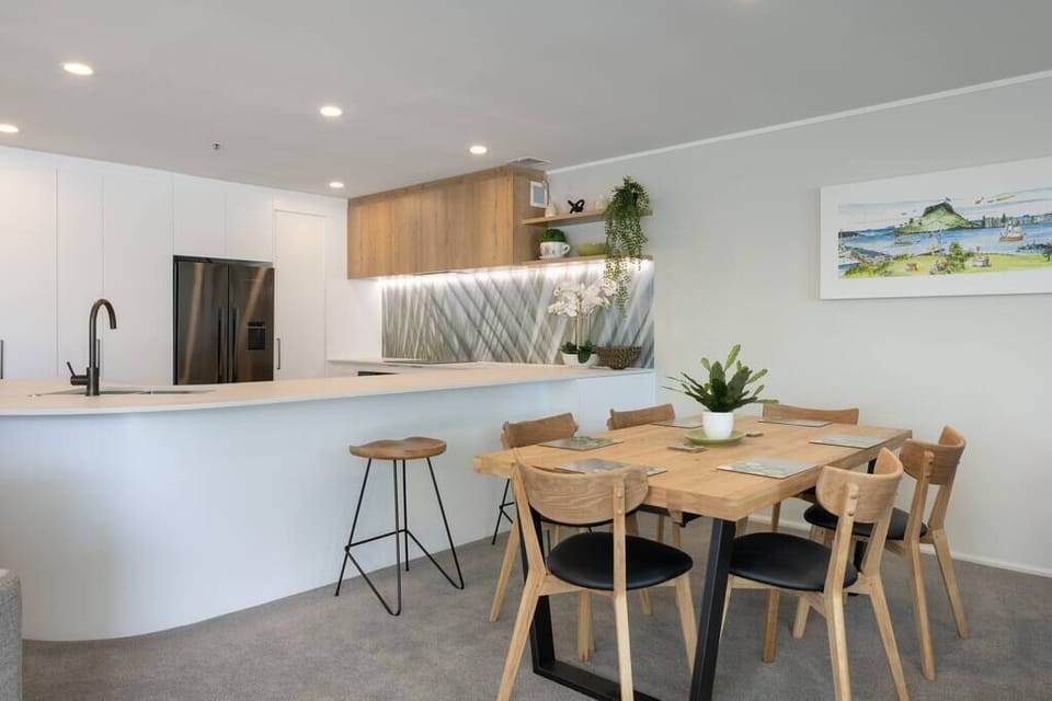 Open plan living with dining area, breakfast bar and modern kitchen.
