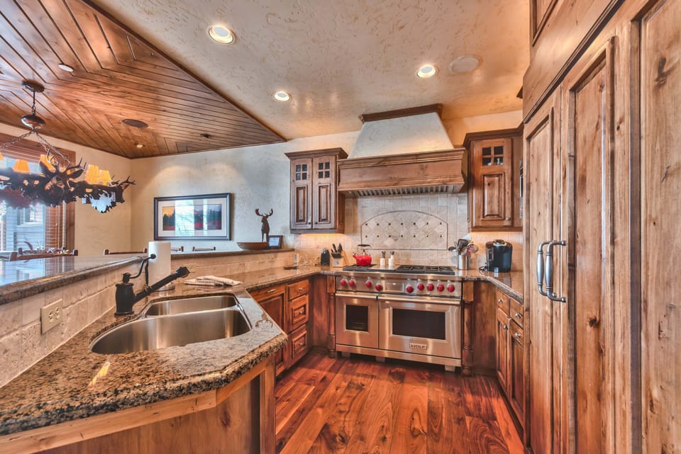 Fully Equipped Gourmet Kitchen with a Wolf 6-Burner Gas Range with Double Convection Ovens, SubZero Refrigerator, and High-end Finishes and Touches