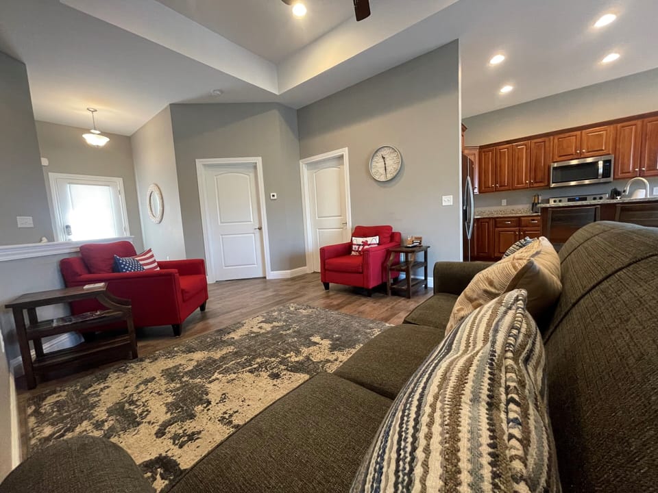 Living room has sofa that folds out into a full size bed.