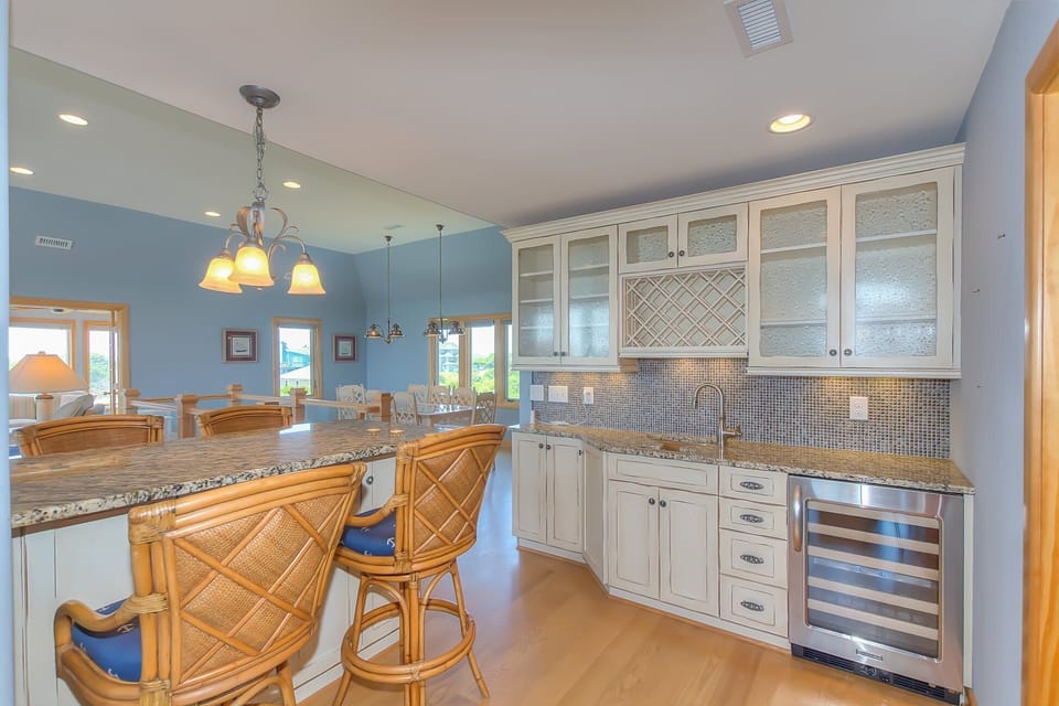 Top Floor:  Wet Bar, Butler's Pantry.  Martini shaped sink and wine cooler. 