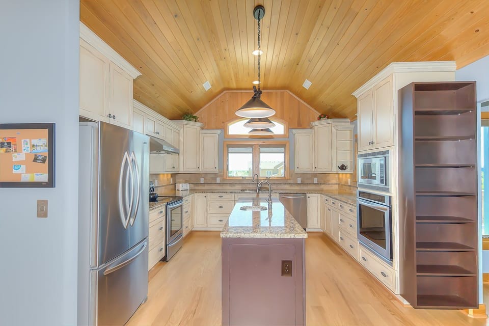 Top Floor:  Custom kitchen with barreled, ship lap ceiling.