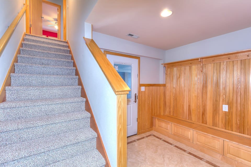 Bottom Floor:  Entry with custom storage and seating.