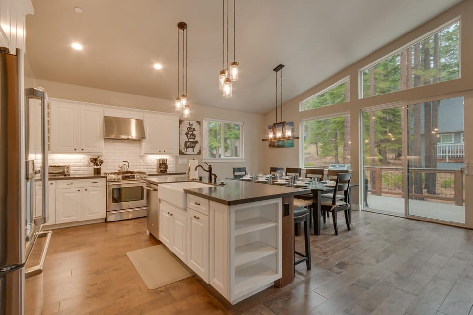- Modern kitchen with large island  
- Stainless appliances and bright space  
- Airbnb home with chef style cooking