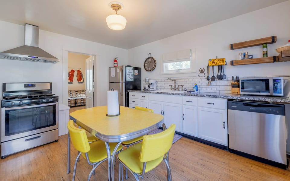 The sunny kitchen with eat in dining space offers the ease of preparing meals while you travel