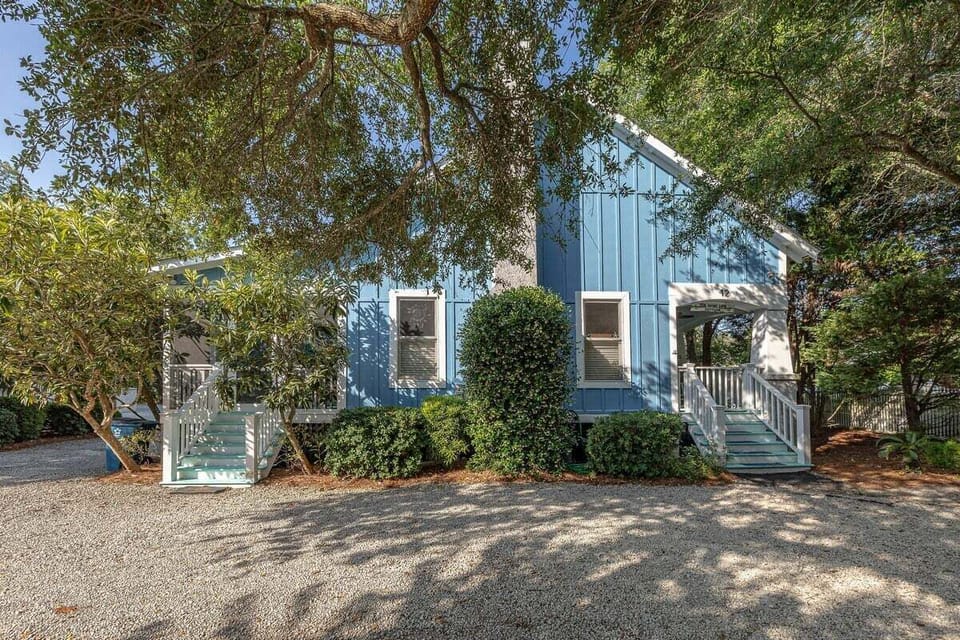 Frontal view of 12 Live Oak Place with stairs and porch