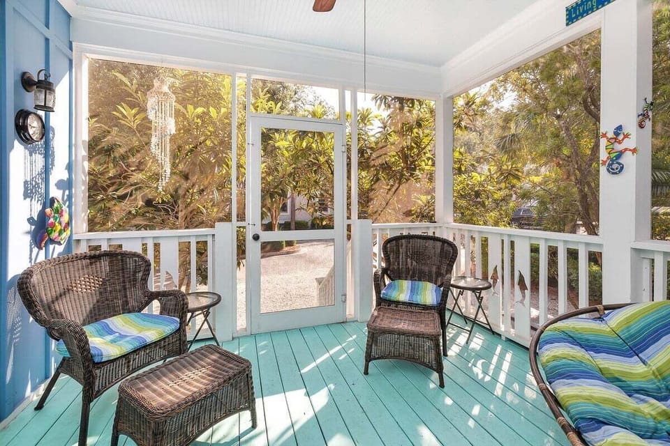 Screened in porch with outdoor chairs