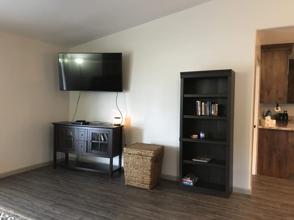  tv /entertainment center with movies ,Toy box ,books and games.